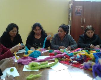 Picture of MISOL single mothers and grandmothers in a handcraft workshop.

&nbsp;
