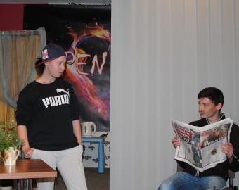 Young leaders acting in a theatre play
